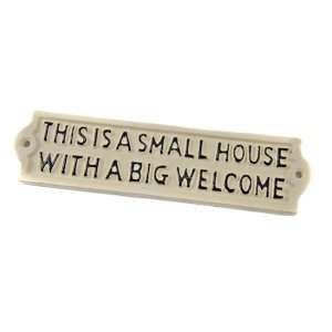 Cast In Style This is a small house with a big welcome sign - cream finish