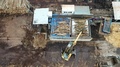 Pond5 A loader loads logs at a wood processing factory from above from a drone