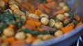 Close-Up Of Mixing A Healthy Vegan Dish Of Chickpea, Onion And Cabbage