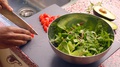 Close Up Person Preparing Fresh Vegan Salad In Kitchen -8s
