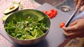 Close Up Person Preparing Fresh Vegan Salad In Kitchen-8s