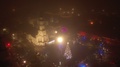 Drone Aerial View Of Kaunas Town Hall Square In The Foggy Night. Winter