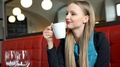 Elegant Woman Looks Happy While Drinking Coffee And Relaxing In Restaurant