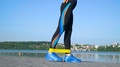 Pond5 Fit athletic woman in sportswear using elastic band with stretch legs and all