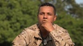 Hispanic Male Soldier Contemplating Wearing Camo