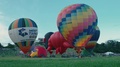 Pond5 Luye - hot air balloons on green field at taiwan international balloon festival.