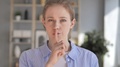 Silent, Young Girl With Finger On Lips