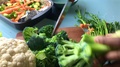 Slow Motion Of Person Chopping Broccoli For Vegan Dish -25 Sec