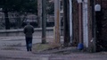 Video Of Man Walking Away At A Distance In A City In An Alley.