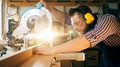 Woodworker With A Circular Saw Is Processing Wood In Slow Motion