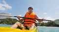 Young Handsome Man Paddling On Kayak Boat In The Sea. Slow Motion. 1920x1080